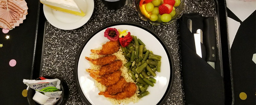 hospital meal of fried coconut shrimp on rice with green beans